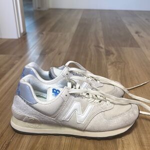 New Balance 574 Cream Sneakers with Blue Accents